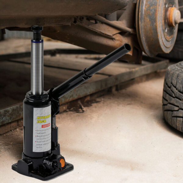 Car,On,Tire,Mounting,With,Removed,Wheel,On,Pneumatic,Jack.