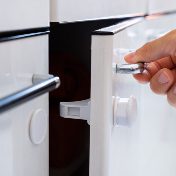 Close-up,Photo,Of,Man,Opening,Child,Proof,Kitchen,Cabinets